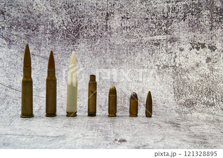 Ammunition for different weapons arranged in a row. 121328895