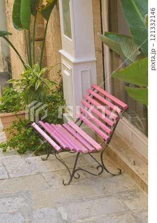 Charming Pink Bench on a City Street 121332146