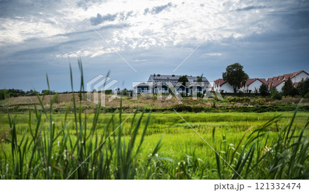 Amazing Countryside Landscape With Rural Houses Against A Cloudy Sky. Amazing Countryside 121332474