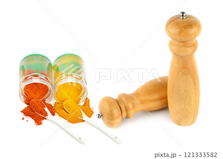 An assortment of oriental spices and seasonings spice mill isolated on a white background An assortment of oriental spices and seasonings spice mill isolated on a white background 121333582