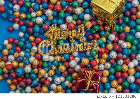 Colorful festive Christmas decorations with gifts and glittering balls 121333896