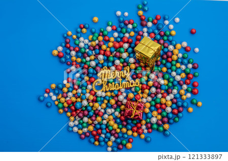 Colorful Christmas decoration with glitter balls and festive gift boxes 121333897