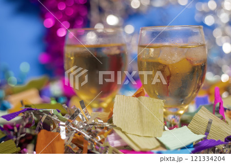 Festive celebration with sparkling drinks and colorful party decorations 121334204