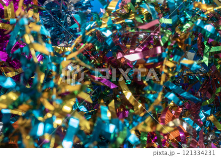 Colorful tinsel background for festive and holiday celebrations Colorful tinsel background for festive and holiday celebrations 121334231