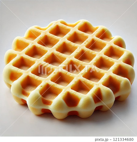 A close-up of a golden-brown waffle, highlighting its crispy texture and grid pattern, against a plain background 121334680