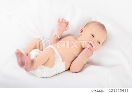 Little baby on white bed Little baby on white bed 121335451