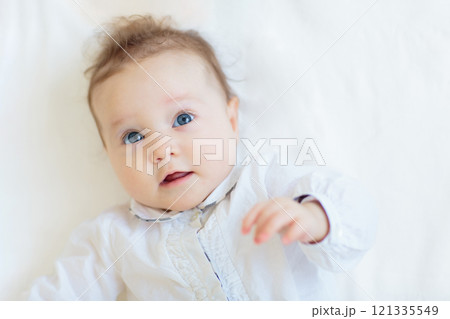 Little baby on white bed Little baby on white bed 121335549