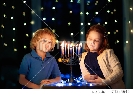 Kids celebrating Hanukkah. Festival of lights. 121335640