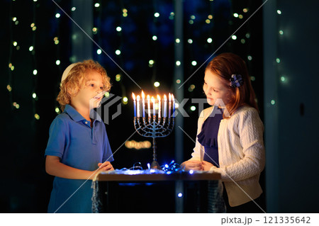 Kids celebrating Hanukkah. Festival of lights. 121335642