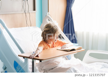 Sick child in hospital room. Kid in clinic ward. 121335707