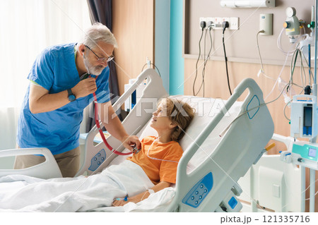 Sick child in hospital room. Kid in clinic ward. Sick child in hospital room. Kid in clinic ward. 121335716