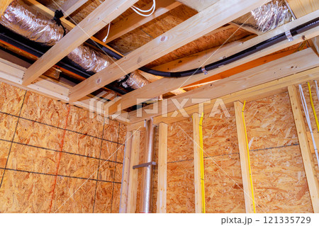Construction on installing wood framing ductwork in new home under development during construction new house Construction on installing wood framing ductwork in new home under development during construction new house 121335729