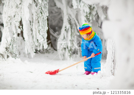 Kids play in snow in winter park 121335816