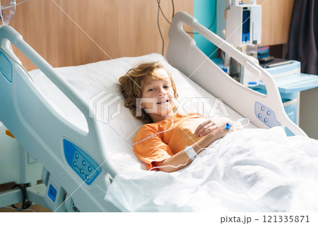 Sick child in hospital room. Kid in clinic ward. 121335871
