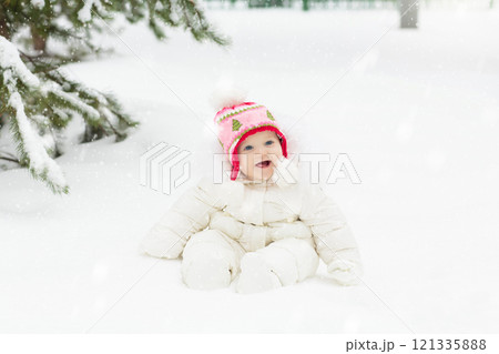 Kids play in snow in winter park Kids play in snow in winter park 121335888