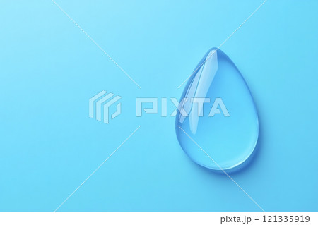 Big water drop resting on light blue background 121335919