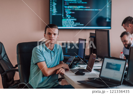 Programmers engrossed in deep collaboration, diligently working together to solve complex problems and develop innovative mobile applications with seamless functionality. Programmers engrossed in deep collaboration, diligently working together to solve complex problems and develop innovative mobile applications with seamless functionality. 121336435