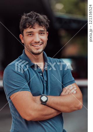 Portrait of a young successful entrepreneur in front of the company 121336524