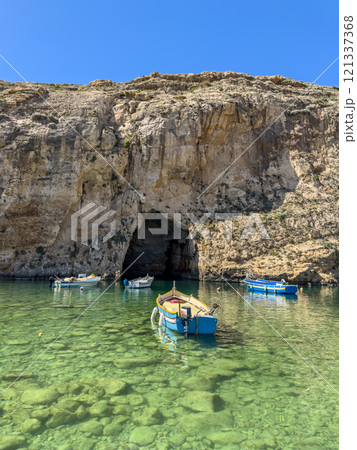 The Inland Sea and tourist boat. Dwejra is a lagoon of seawater on the island of Gozo. 121337368