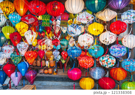 colorful Vietnamese glowing silk lanterns in Vietnam in Asia in the old town on streets of Hoi An city in night market 121338308