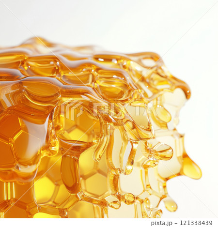close up of golden honeycomb dripping with fresh honey, showcasing its intricate hexagonal pattern and glossy texture. image captures natural beauty and richness of honey 121338439