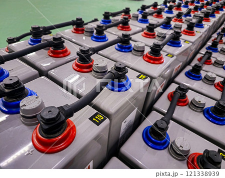 A row of batteries with red, blue, and white caps A row of batteries with red, blue, and white caps 121338939