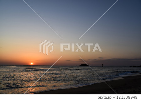 The sun is setting over the ocean The sun is setting over the ocean 121338949