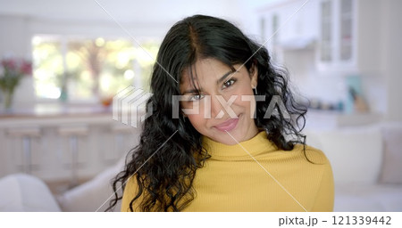 Portrait of happy biracial female teenager with long hair at home 121339442