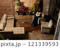 young girl christmas holiday celebration woman fireplace tree home alone cozy new year 121339593