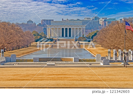 Iconic view of the Lincoln Memorial with the Reflecting Pool under a sunny sky in Washington DC 121342603