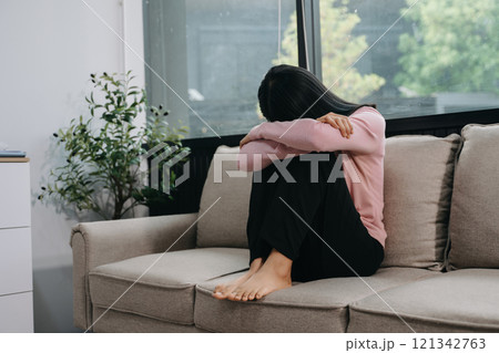 woman sit Depression Standing by window and anxiety Copy space. woman sit Depression Standing by window and anxiety Copy space. 121342763