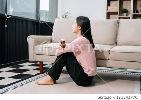 woman sit Depression Standing by window and anxiety Copy space. woman sit Depression Standing by window and anxiety Copy space. 121342770