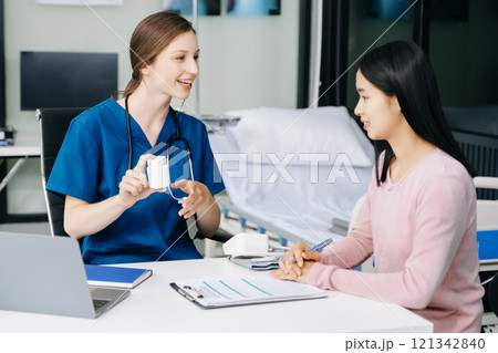 Doctors explain the use of medication to patients. healthcare and medical concept. 121342840