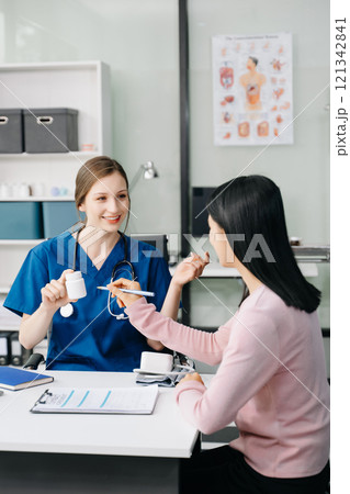 Doctors explain the use of medication to patients. healthcare and medical concept. 121342841