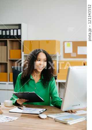 Startup small business SME, Entrepreneur owner woman using smartphone or tablet taking receive 121343552