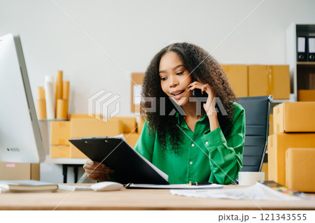 Startup small business SME, Entrepreneur owner woman using smartphone or tablet taking receive Startup small business SME, Entrepreneur owner woman using smartphone or tablet taking receive 121343555
