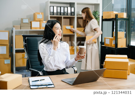 Small business entrepreneur SME freelance Asian woman and woman working at home office Small business entrepreneur SME freelance Asian woman and woman working at home office 121344031