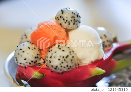 dragon fruit and ice cream or vanilla ice cream , orange ice cream and dragon fruit in the dragon fruit skin or dragon fruit peel dragon fruit and ice cream or vanilla ice cream , orange ice cream and dragon fruit in the dragon fruit skin or dragon fruit peel 121345510