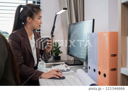 Confident Businesswoman Analyzing Data on Tablet in Modern Office Environment with Laptop and Documents Confident Businesswoman Analyzing Data on Tablet in Modern Office Environment with Laptop and Documents 121346666