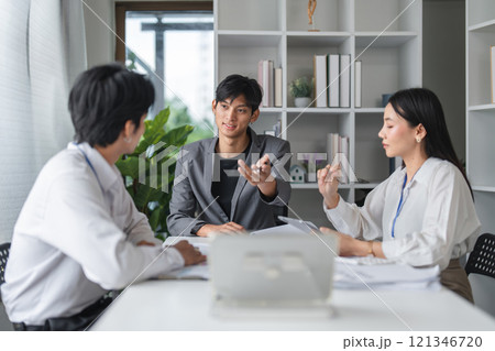 Asian Business Team Meeting in Modern Office to Discuss and Exchange Innovative Ideas for Future Projects and Collaborations 121346720