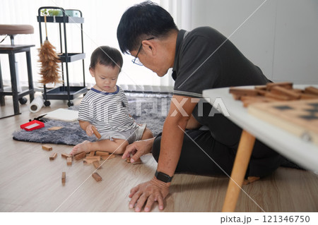 Father and Son Spending Quality Time Together at Home, Building Blocks and Bonding in a Modern Living Room Setting 121346750