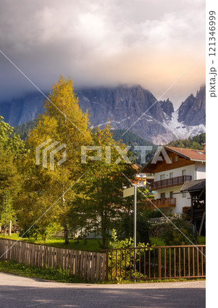 rowan berries branch, alpine house background rowan berries branch, alpine house background 121346999