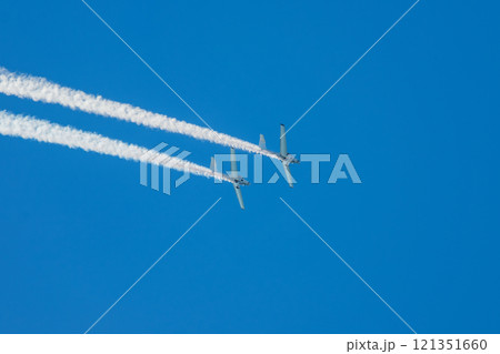 Stunt aerobatic plane performing stunts in air Stunt aerobatic plane performing stunts in air 121351660