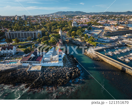 Aerial view of Santa Marta lighthouse and Cascais marina with Cascais cityscape Aerial view of Santa Marta lighthouse and Cascais marina with Cascais cityscape 121351670
