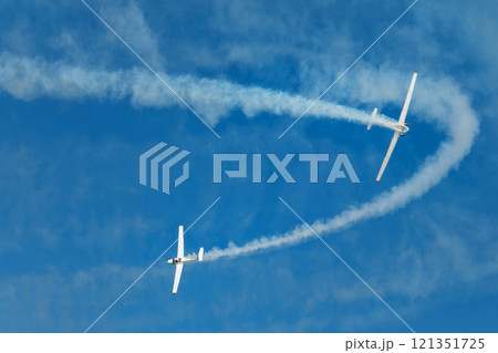 Stunt aerobatic plane performing stunts in air Stunt aerobatic plane performing stunts in air 121351725