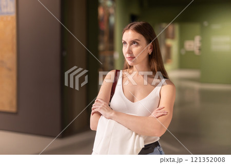 Woman with a smile in the museum 121352008