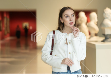 Girl view sculpture in museum hall Girl view sculpture in museum hall 121352020