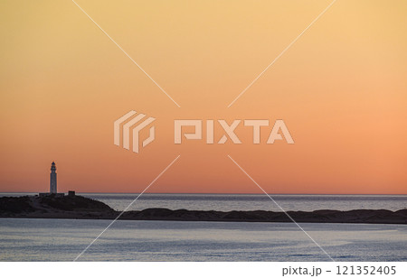 Beautiful sunset on the beach of Los Canos de Meca with the background of the Trafalgar Lighthouse, Barbate, Cadiz Beautiful sunset on the beach of Los Canos de Meca with the background of the Trafalgar Lighthouse, Barbate, Cadiz 121352405