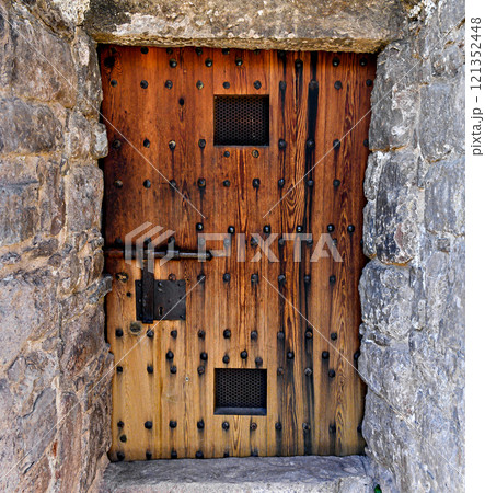 Old wooden door of the entrance of the tower of Cardona Castle Barcelona Spain Old wooden door of the entrance of the tower of Cardona Castle Barcelona Spain 121352448