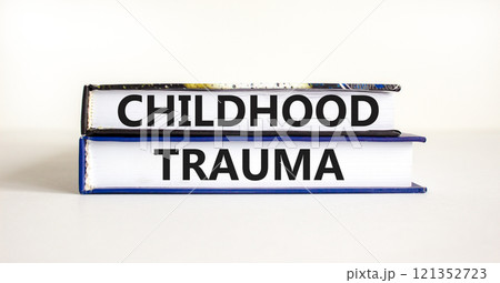 Childhood trauma symbol. Concept words Childhood trauma on beautiful books. Beautiful white table white background. Business psychology childhood trauma concept. Copy space. 121352723